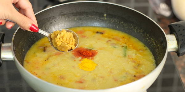 Gujarati Dal Recipe adding red chili powder