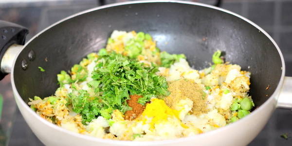 Vegetable Paratha adding fresh coriander leaves