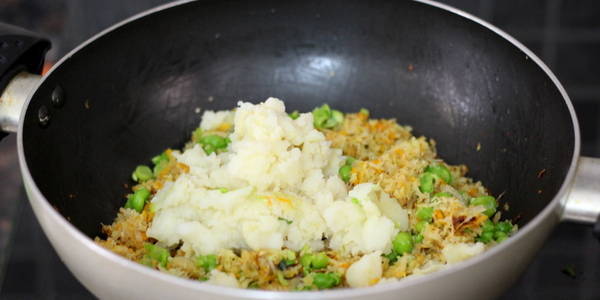 Vegetable Paratha adding potatoes