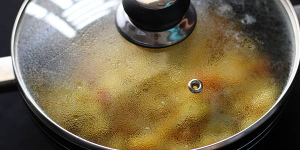 aloo cabbage sabzi cooking in pan