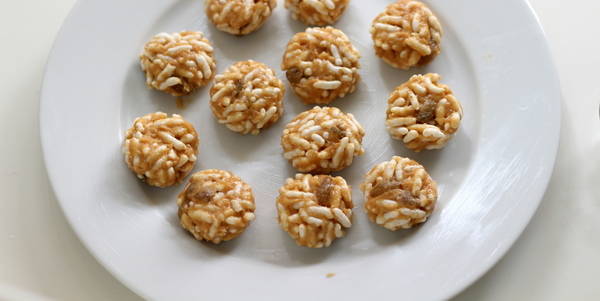 puffed rice peanut butter balls making balls