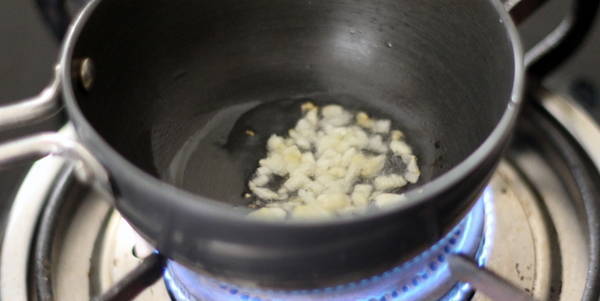 Palak Corn Soup  tempering adding garlic