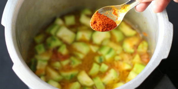 Turai Moong Dal adding red chili powder