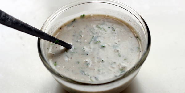 mixing spices in yogurt for pineapple raita recipe