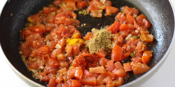 tomato peanut curry  adding indian spices