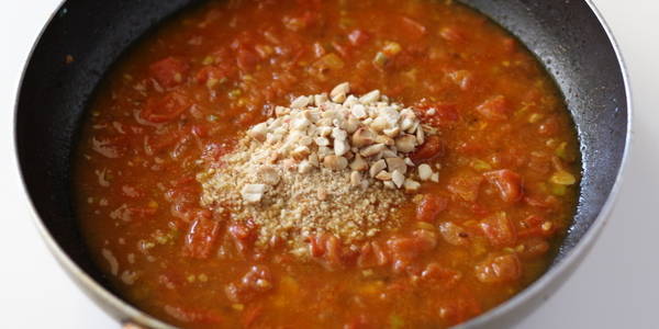 tomato peanut curry  adding peanut powder