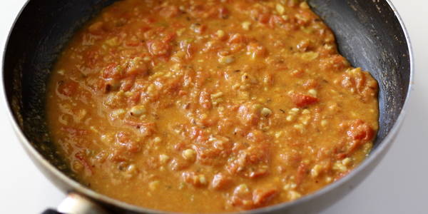 tomato peanut curry cooking