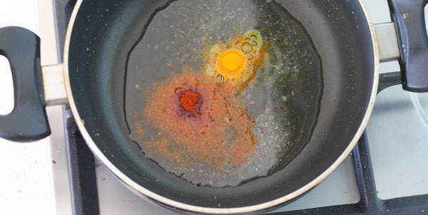 masala puffed rice add turmeric powder and red chili powder